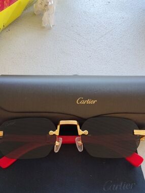 Cartier Gold Rimless Sunglasses with Black Lenses and Red Temples